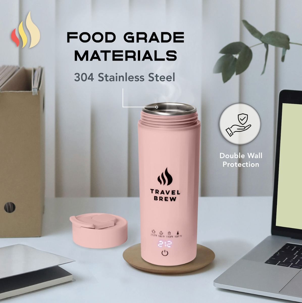 Pink Travel Brew portable electric kettle open with lid on a desk, branding and text about food grade materials.